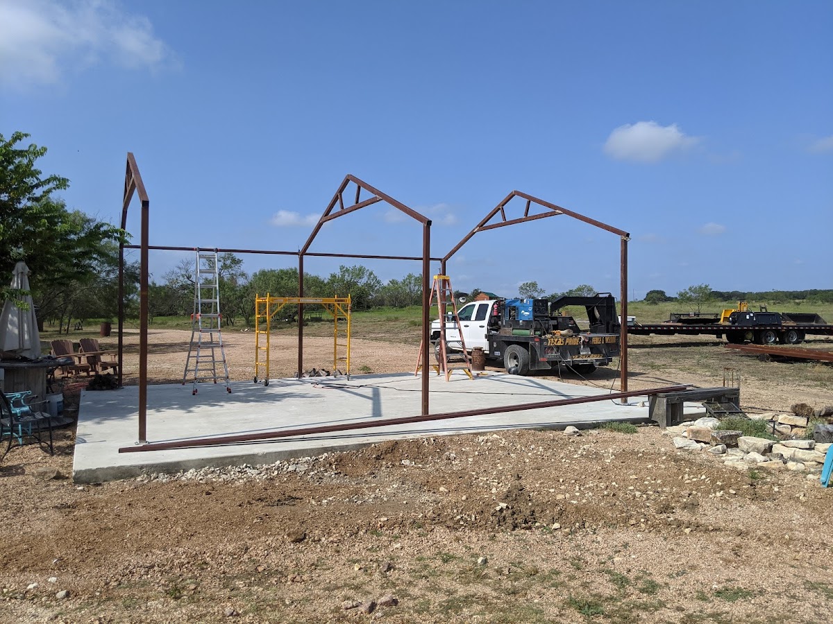 Steel frame structure being erected at a Texas property